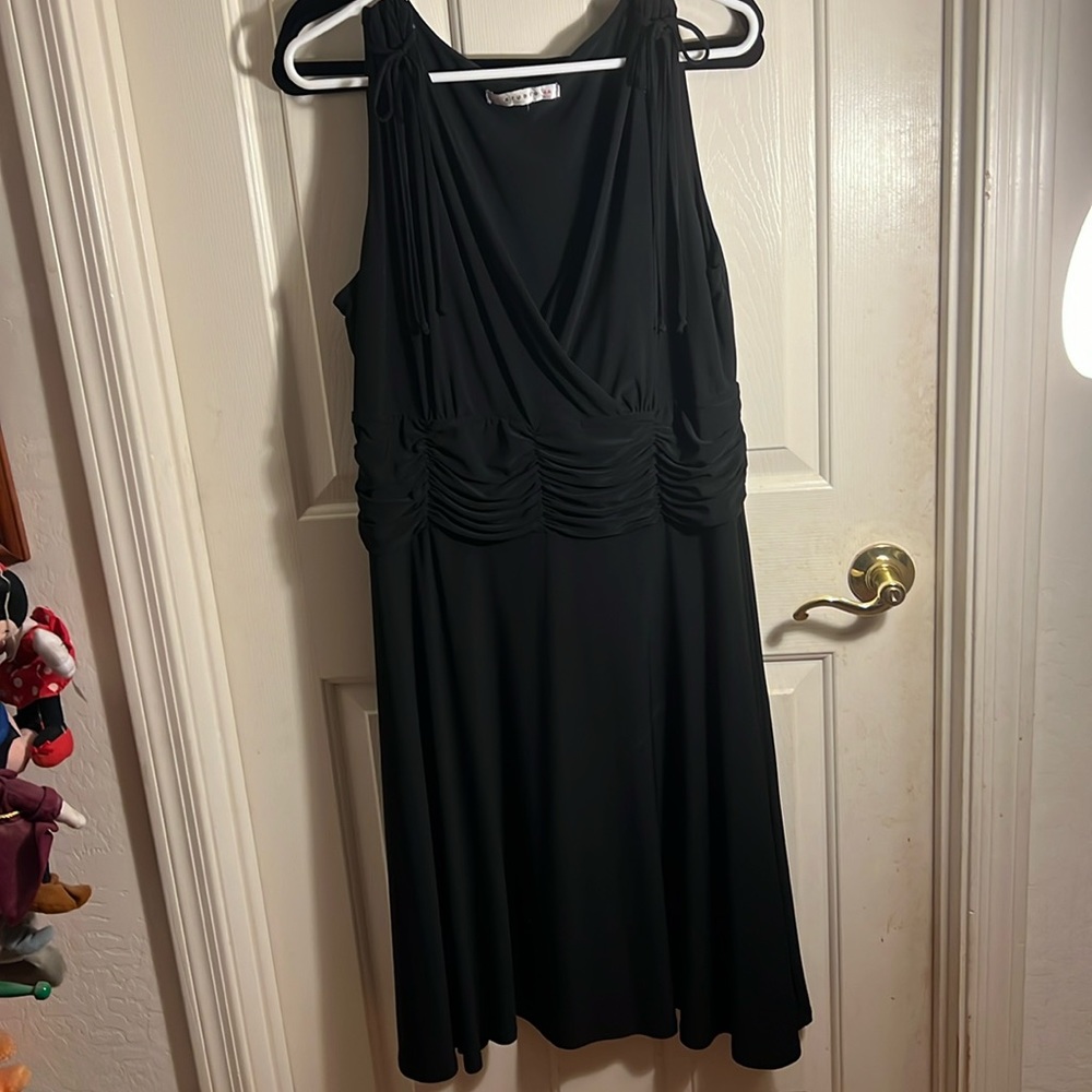 Super stretch black dress with ruched waistline and tie detail at shoulders. 2X